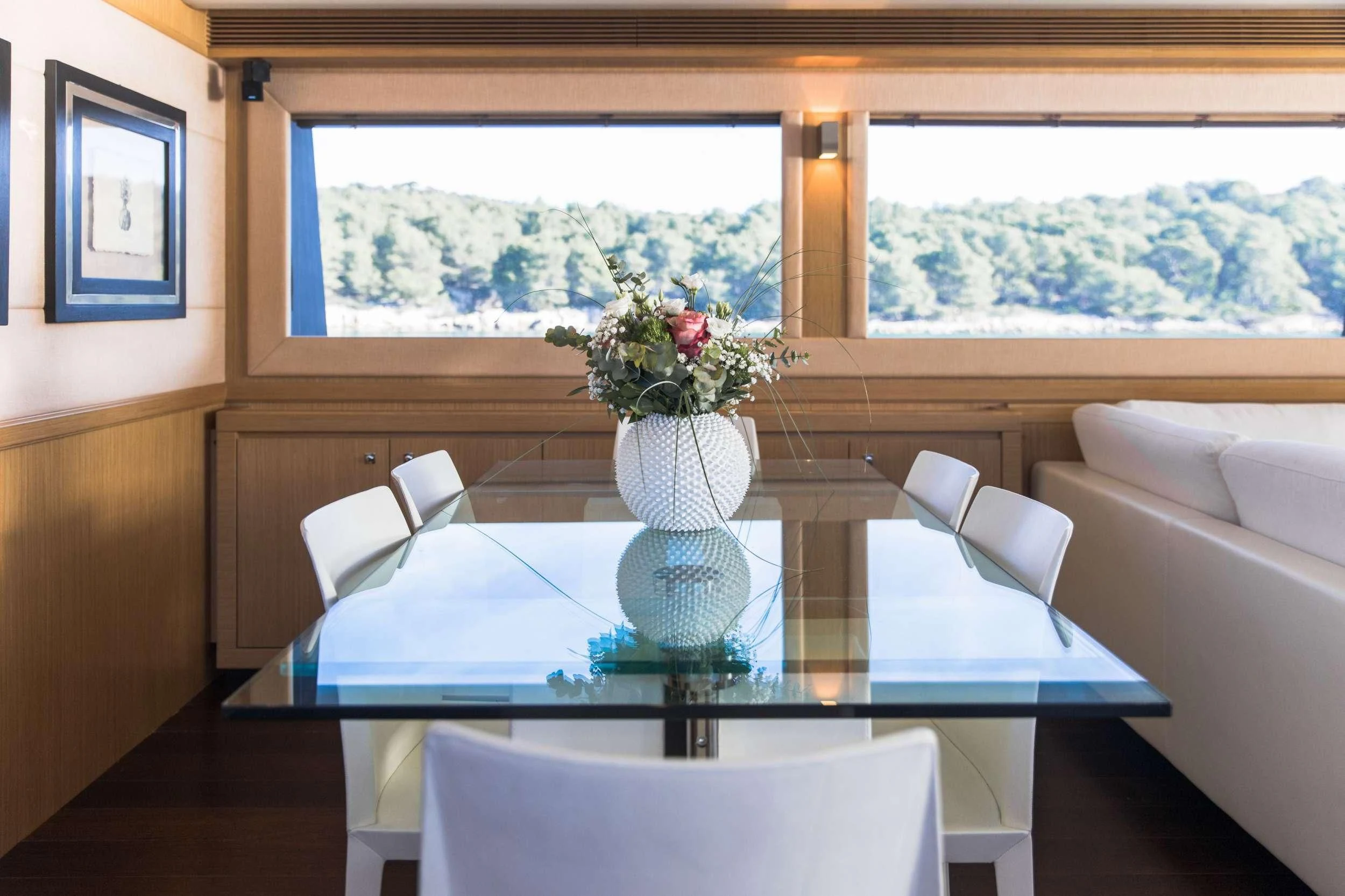 a table with flowers on it aboard FRIEND'S BOAT Yacht for Charter
