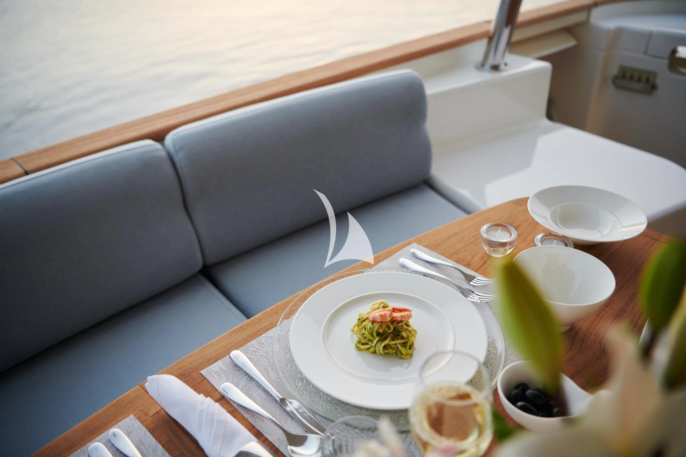 a table with food and drinks aboard FRIEND'S BOAT Yacht for Charter