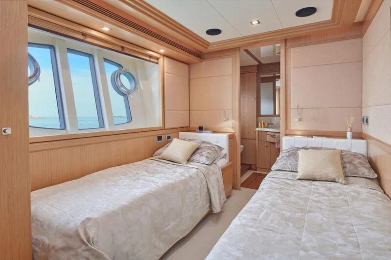 a room with two beds aboard FRIEND'S BOAT Yacht for Charter