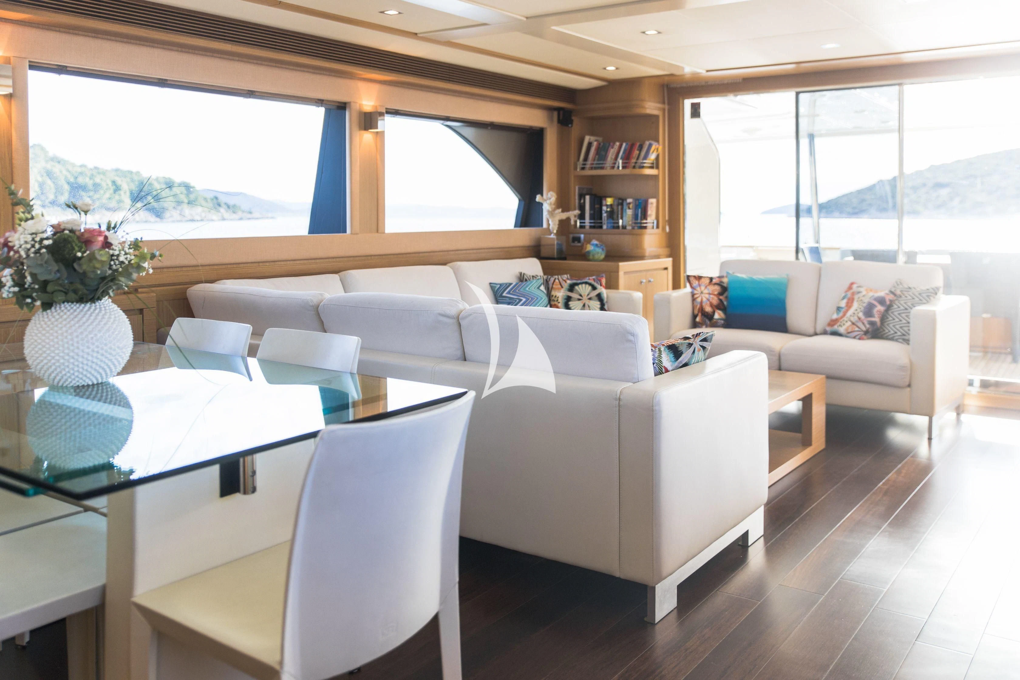 a living room with a couch and a table aboard FRIEND'S BOAT Yacht for Charter
