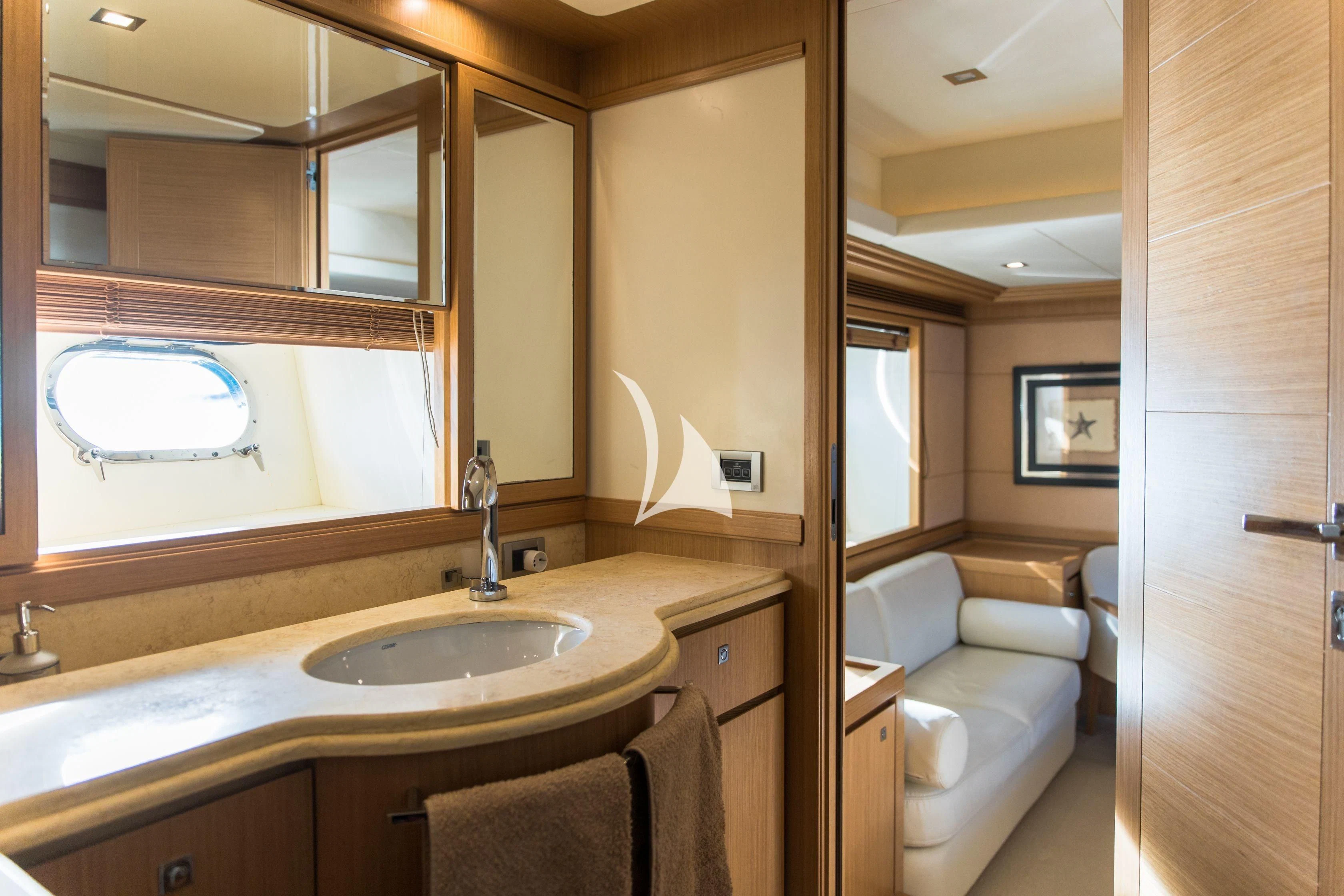 a bathroom with a sink and a mirror aboard FRIEND'S BOAT Yacht for Charter