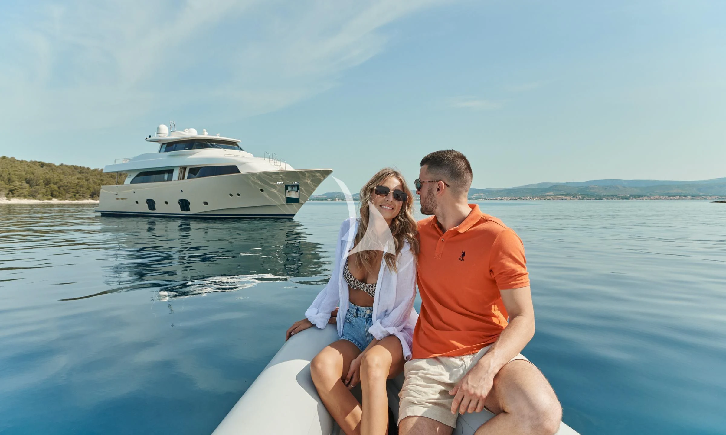 a man and woman sitting on a boat in the water aboard FRIEND'S BOAT Yacht for Charter