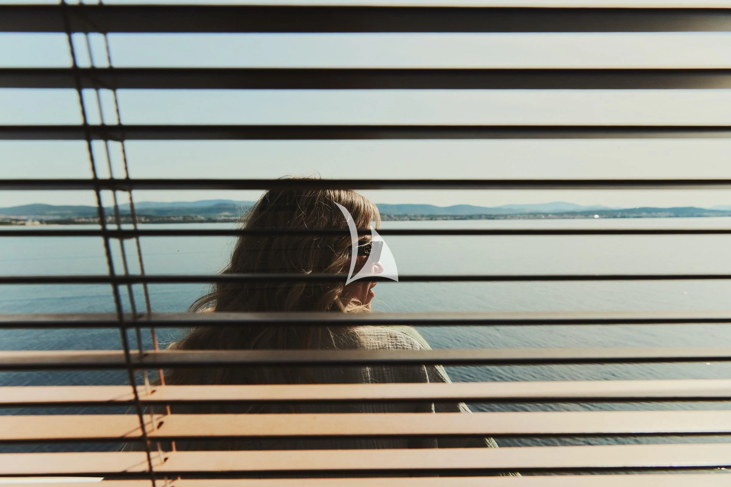 a person looking out a window aboard FRIEND'S BOAT Yacht for Charter