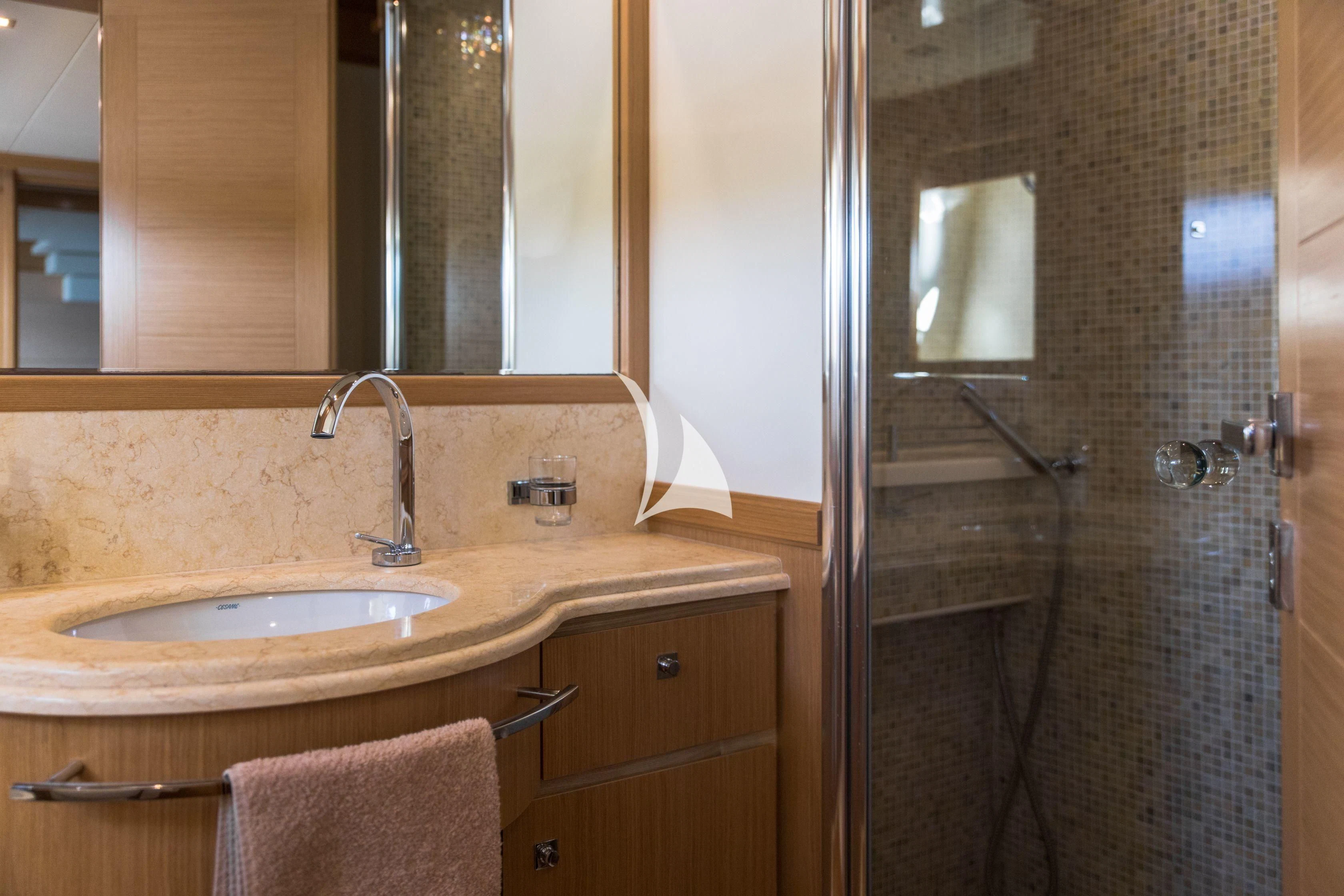a bathroom with a sink and a shower aboard FRIEND'S BOAT Yacht for Charter