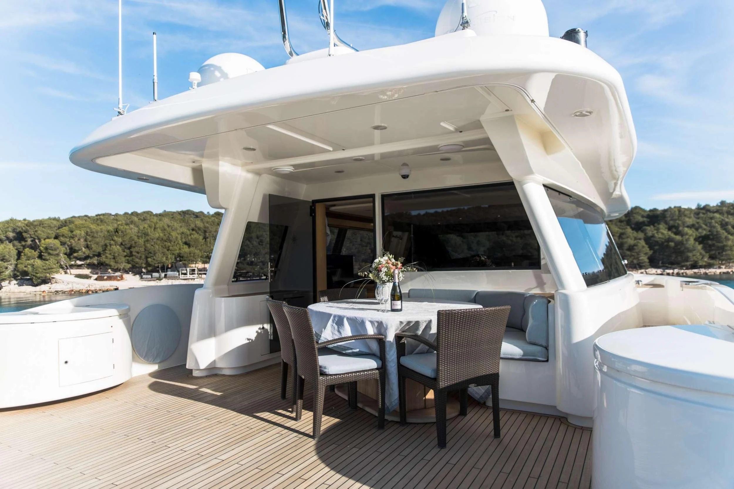 a large white tent with a table and chairs outside aboard FRIEND'S BOAT Yacht for Charter