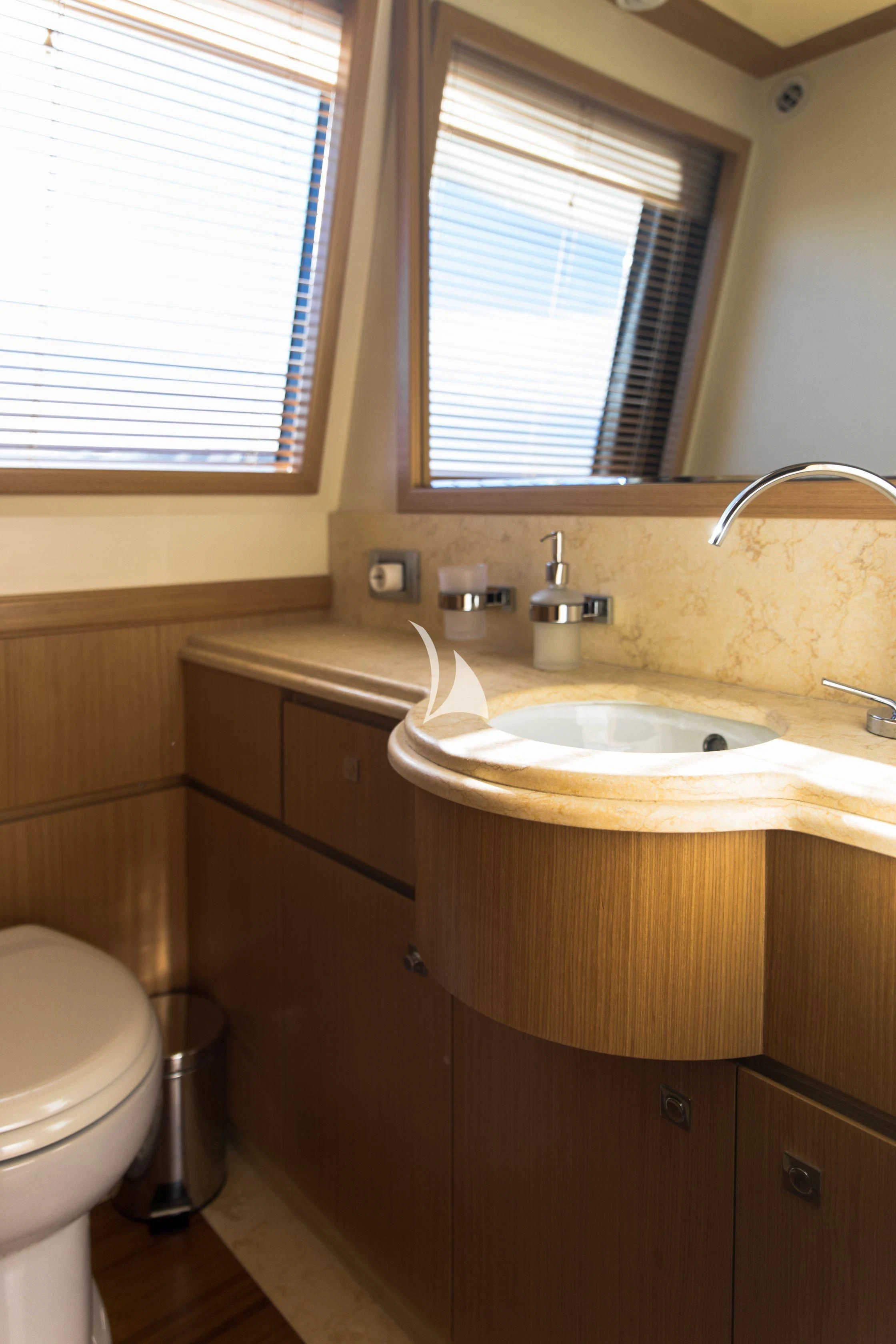 a bathroom with a sink and a toilet aboard FRIEND'S BOAT Yacht for Charter