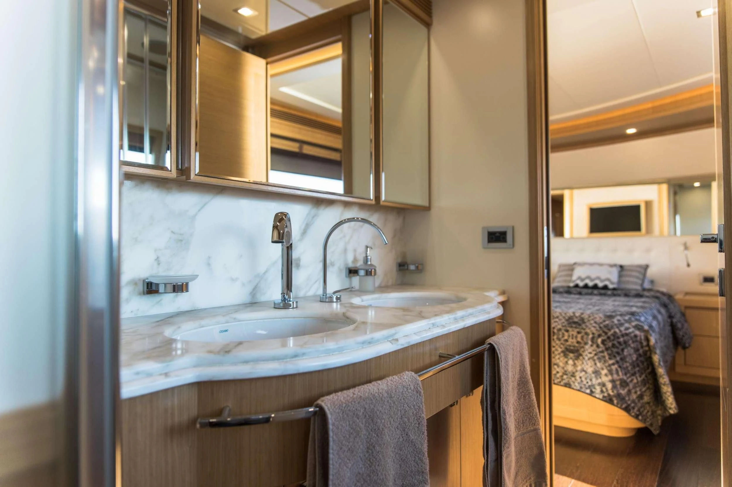 a bathroom with a sink and a bed aboard FRIEND'S BOAT Yacht for Charter