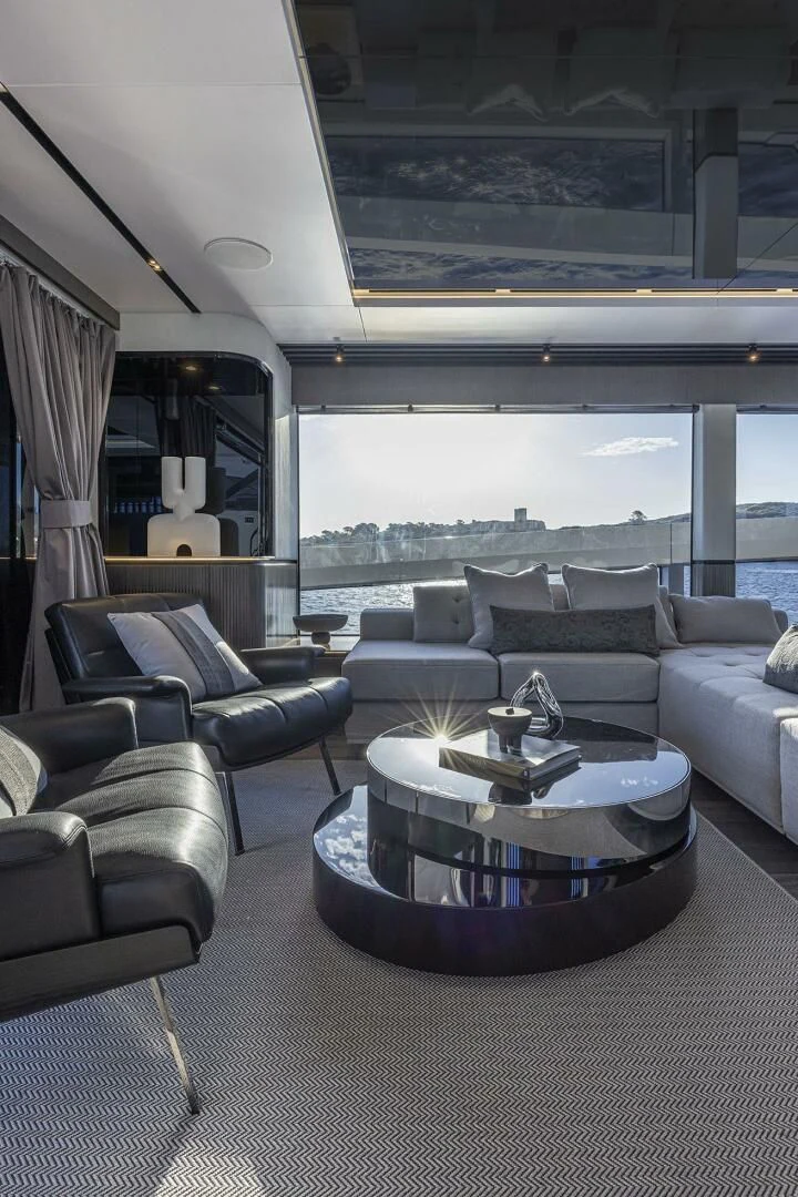 a living room with a large window aboard KNEAD IT Yacht for Sale