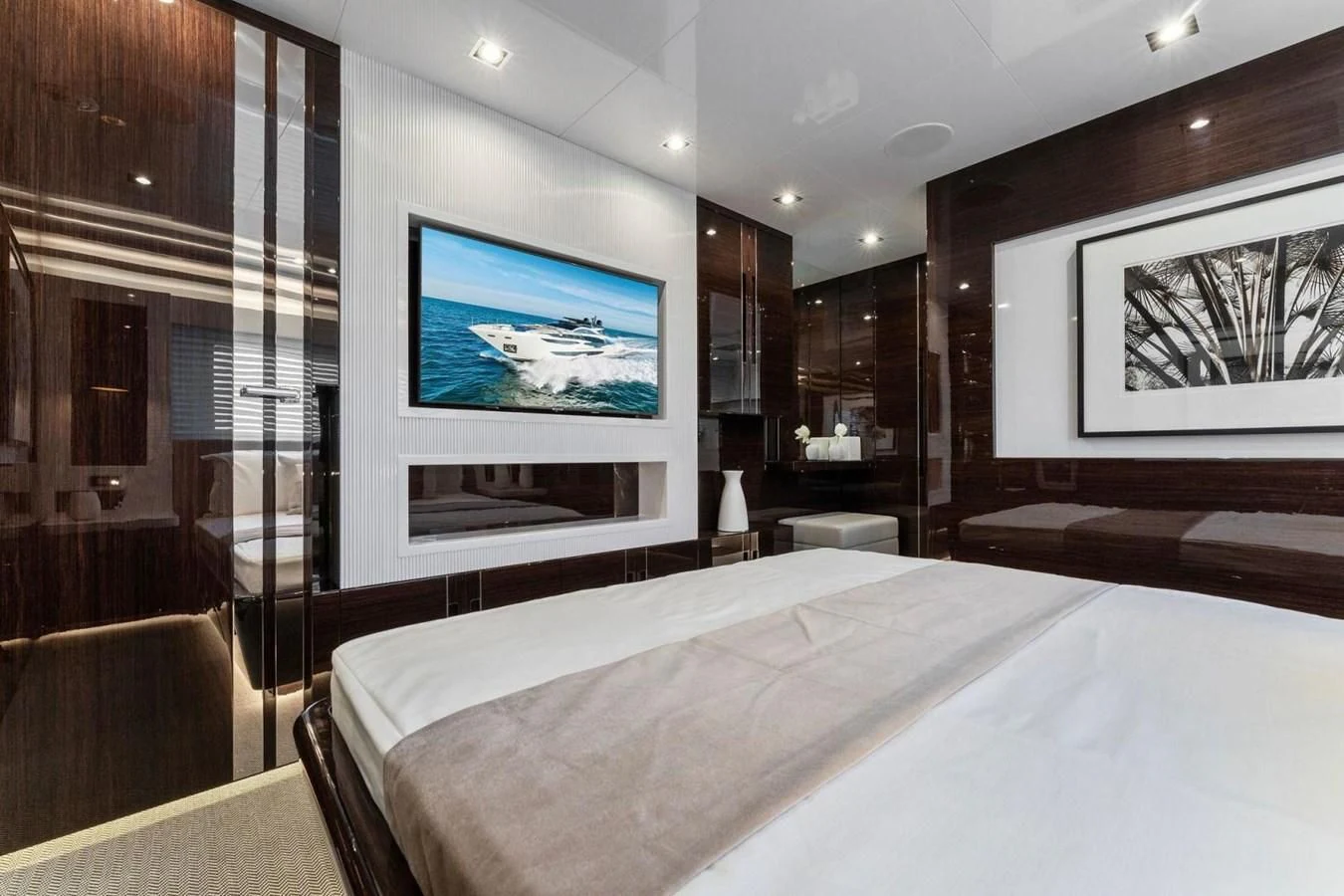 a hotel room with a large screen aboard KNEAD IT Yacht for Sale