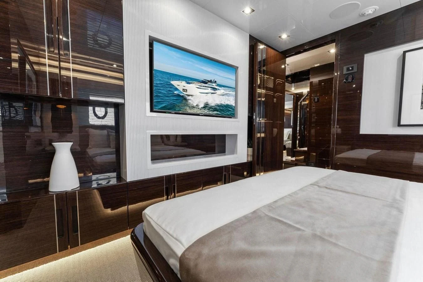 a hotel room with a large screen aboard KNEAD IT Yacht for Sale