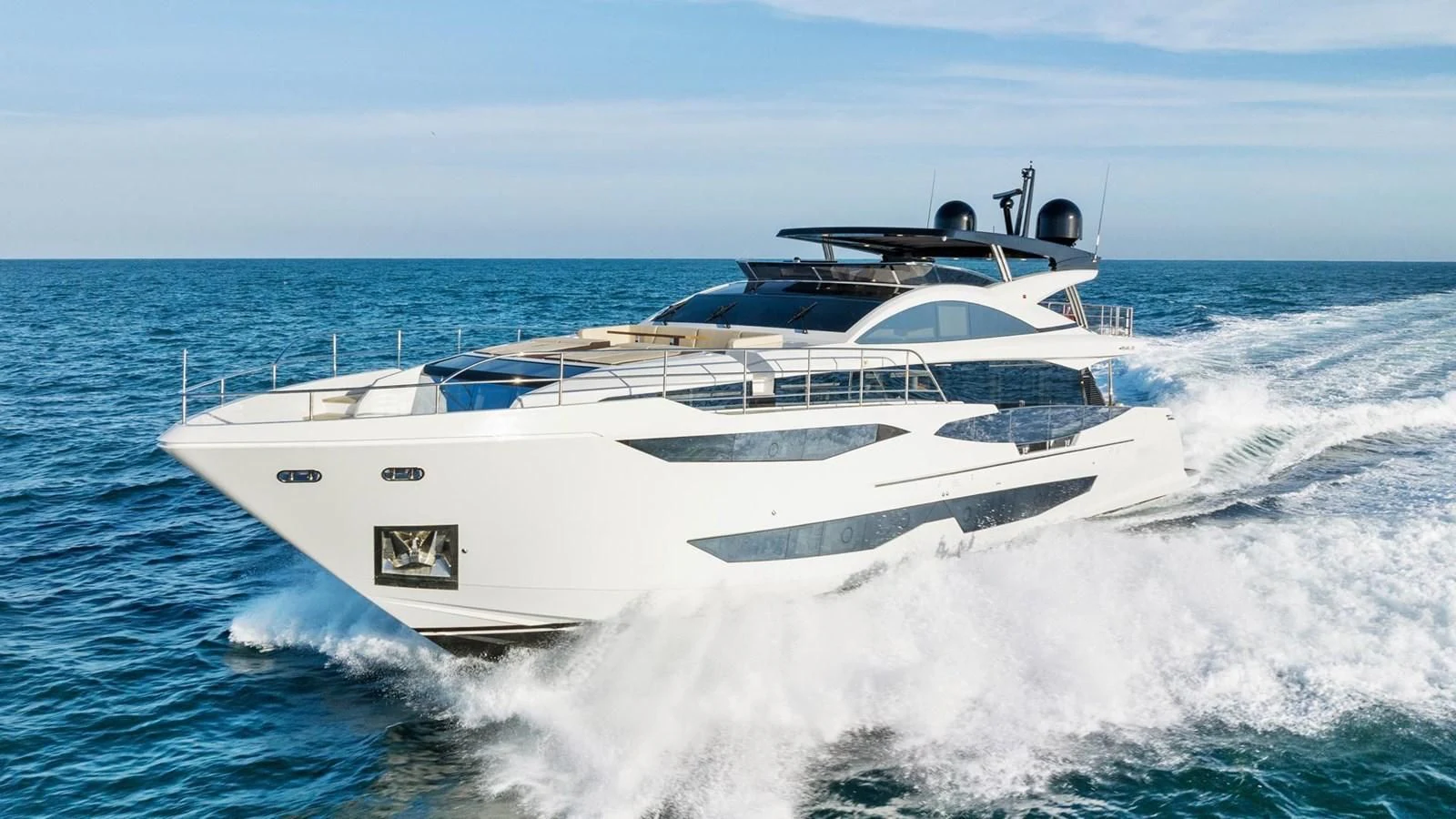 a white yacht on the water aboard KNEAD IT Yacht for Sale