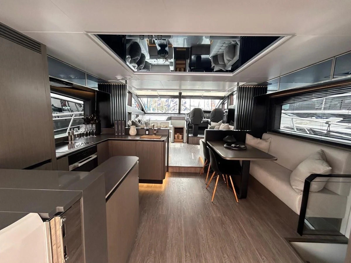 a living room with a large window aboard KNEAD IT Yacht for Sale