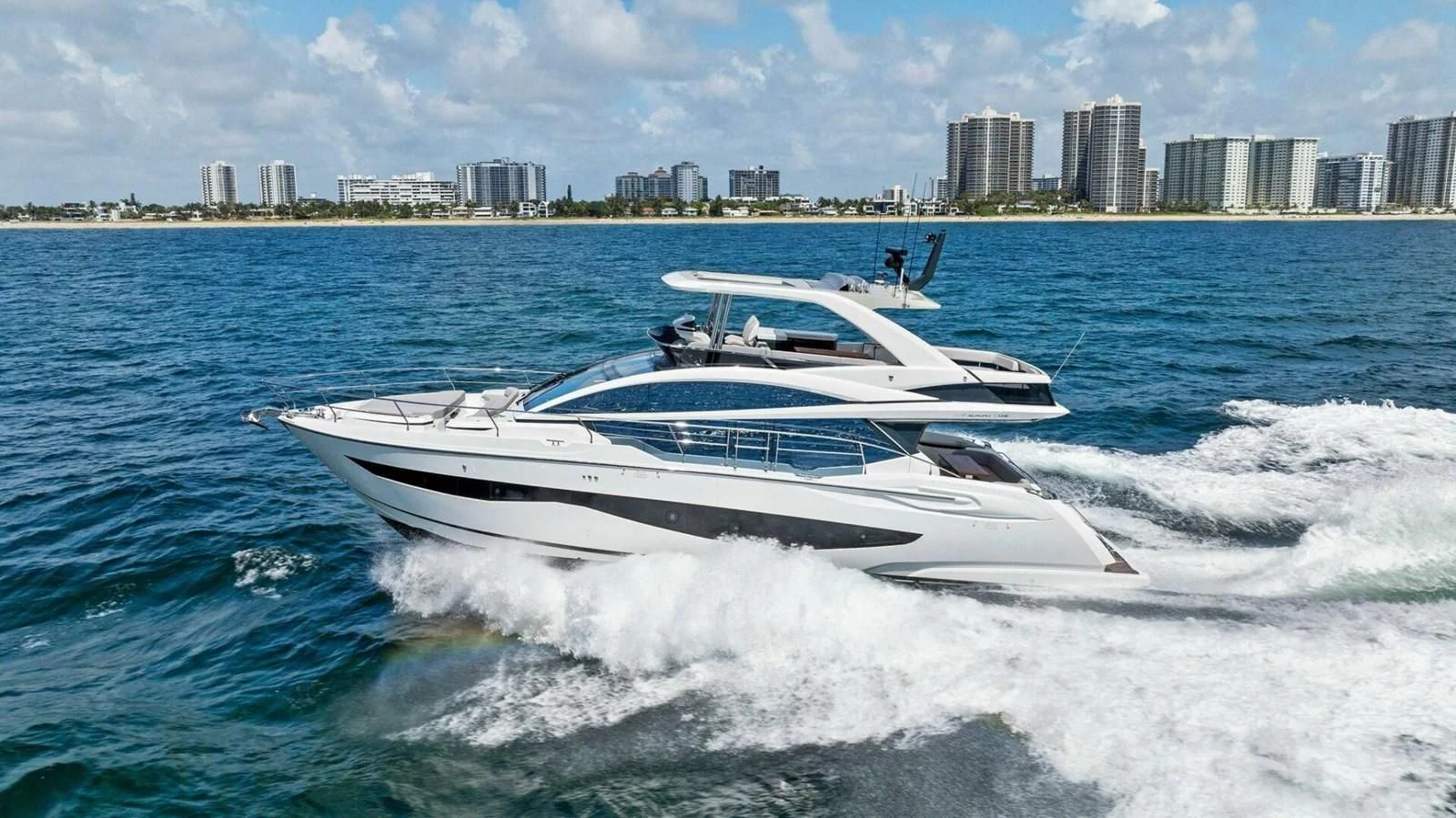 a white boat on the water aboard KNEAD IT Yacht for Sale