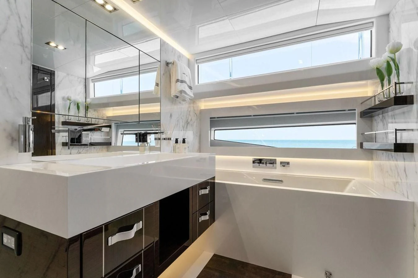 a kitchen with white cabinets aboard KNEAD IT Yacht for Sale