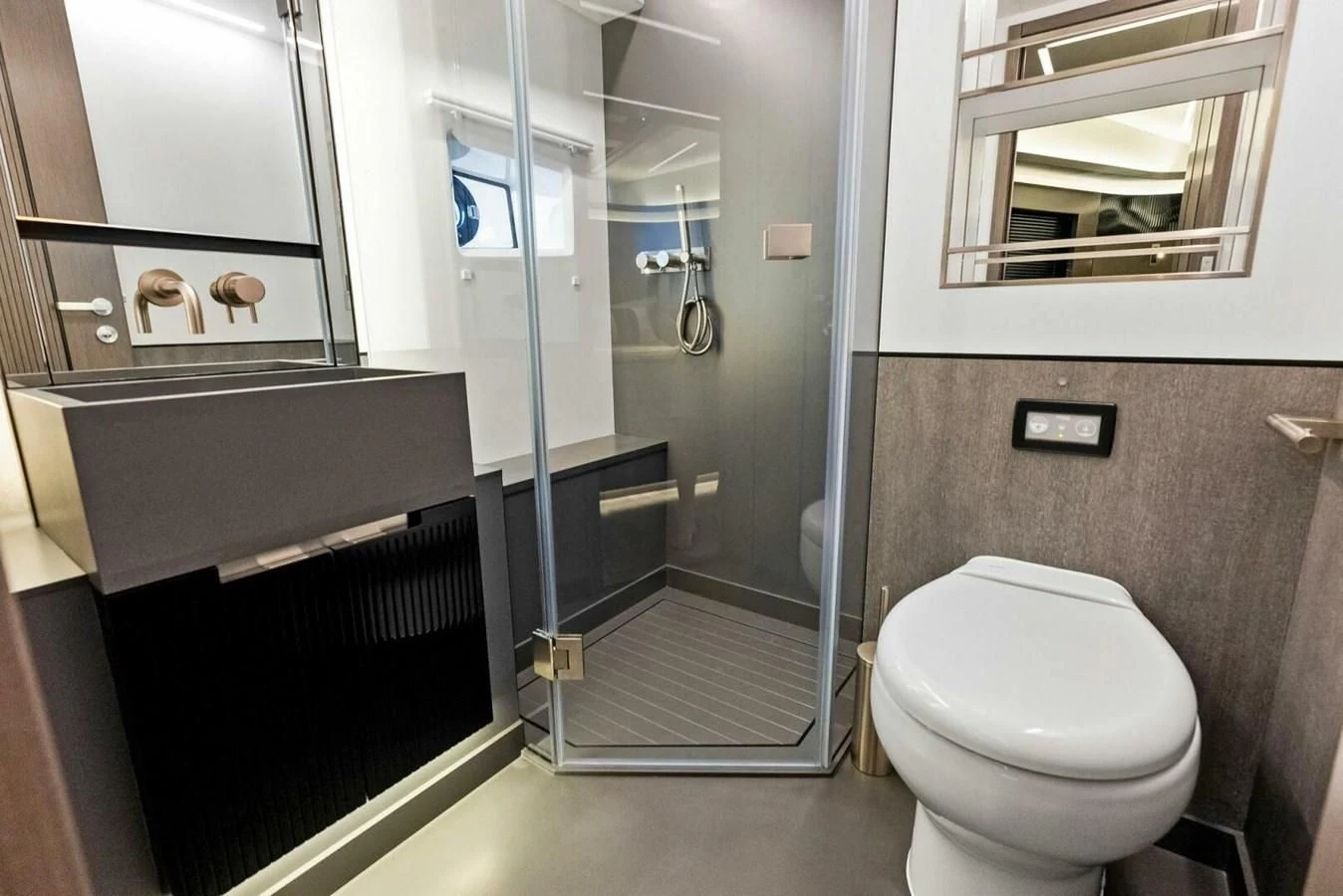 a bathroom with a glass shower aboard KNEAD IT Yacht for Sale