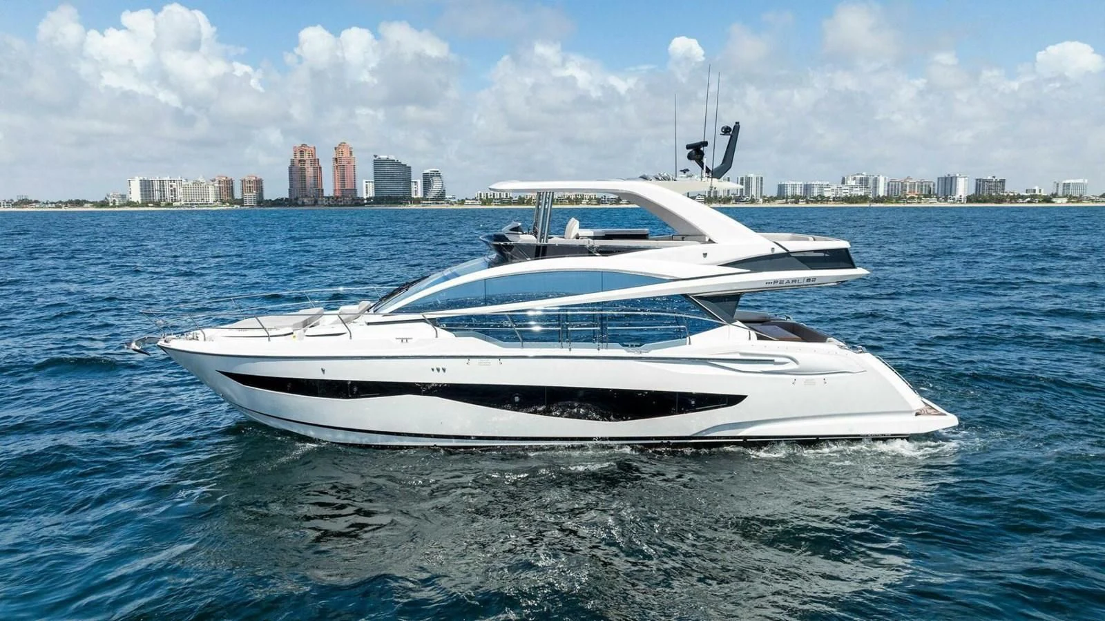 a white yacht in the water aboard KNEAD IT Yacht for Sale