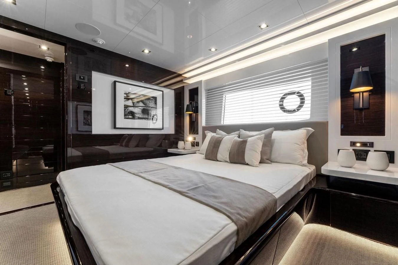 a large bedroom with a large bed aboard KNEAD IT Yacht for Sale