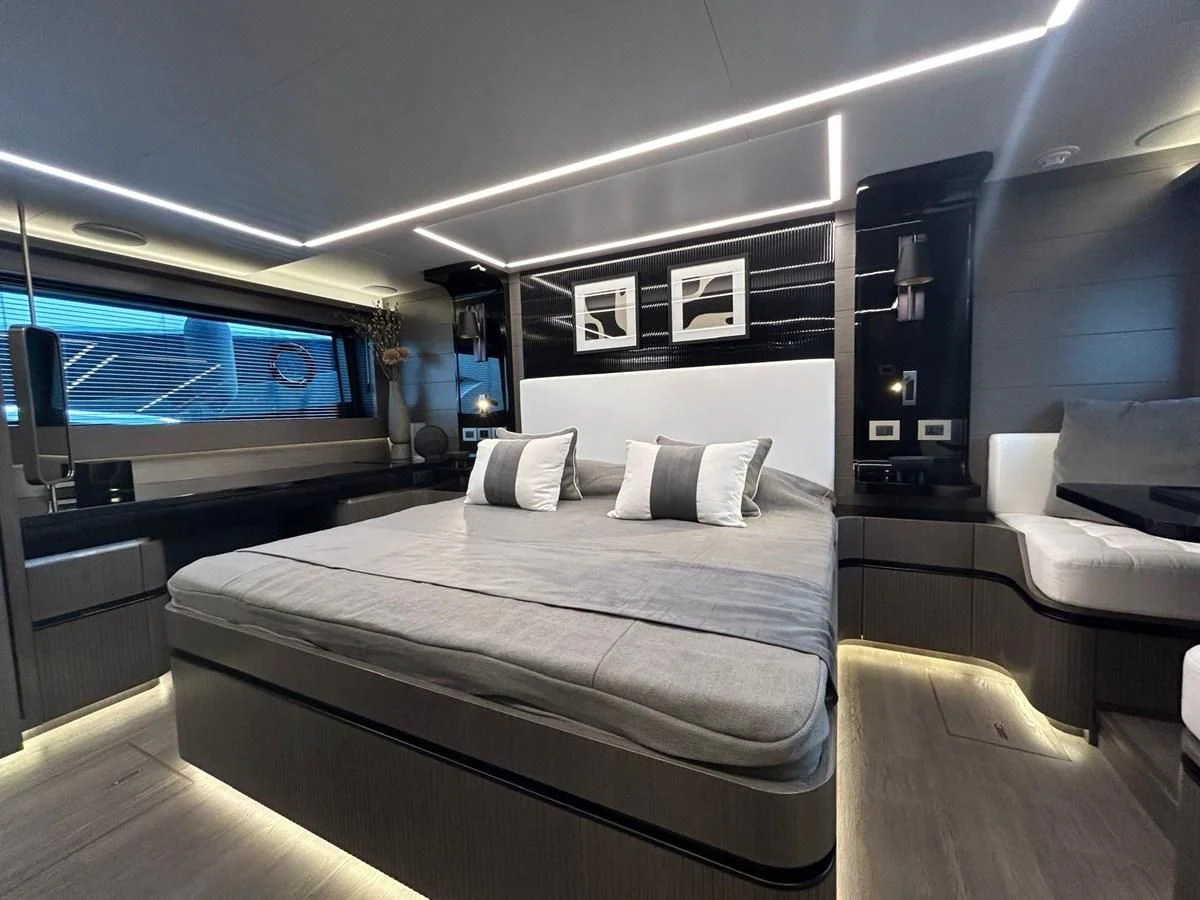 a room with a bed and a tv aboard KNEAD IT Yacht for Sale