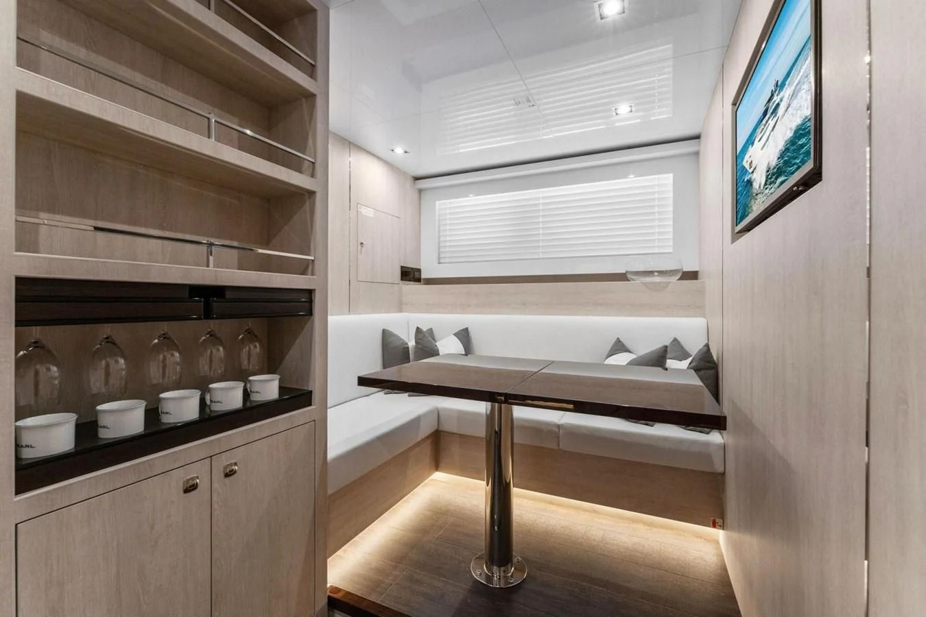 a room with a table and a tv aboard KNEAD IT Yacht for Sale