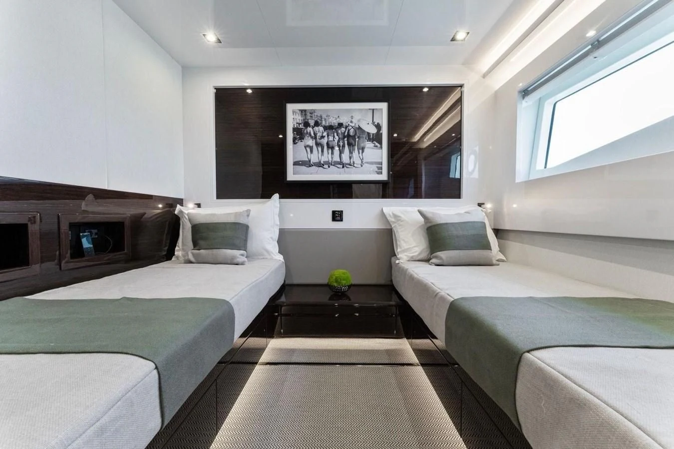 a room with beds and a tv aboard KNEAD IT Yacht for Sale