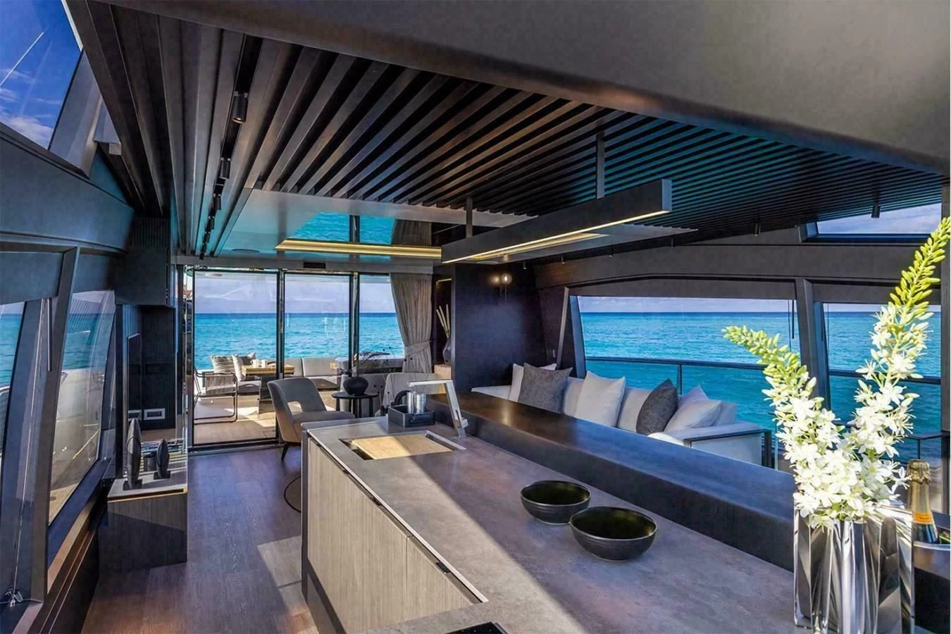 a modern looking living room with a large open floor plan aboard KNEAD IT Yacht for Sale