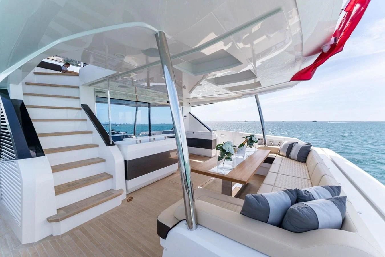 a boat with a bed and a table on the deck aboard KNEAD IT Yacht for Sale
