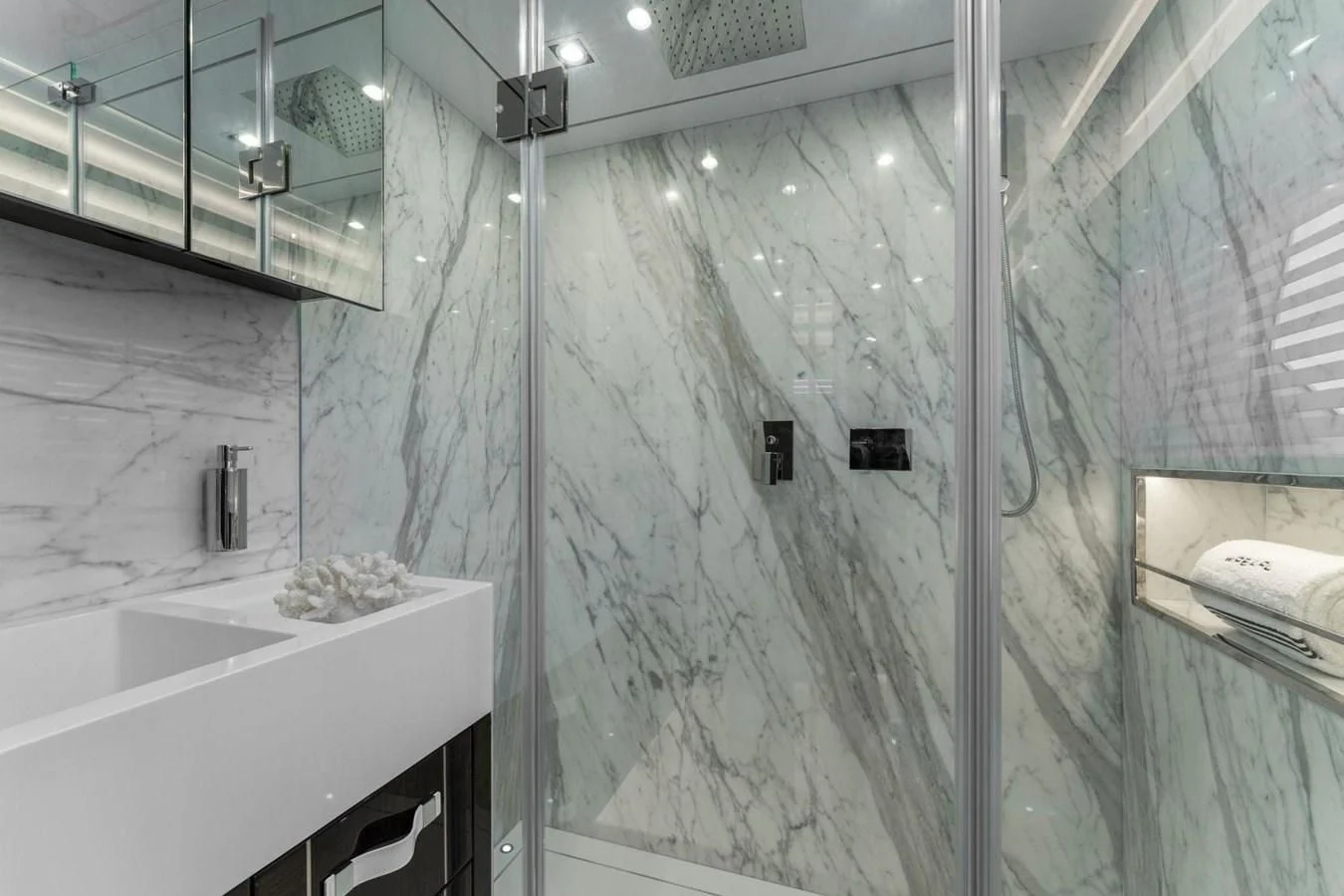 a bathroom with a glass shower aboard KNEAD IT Yacht for Sale