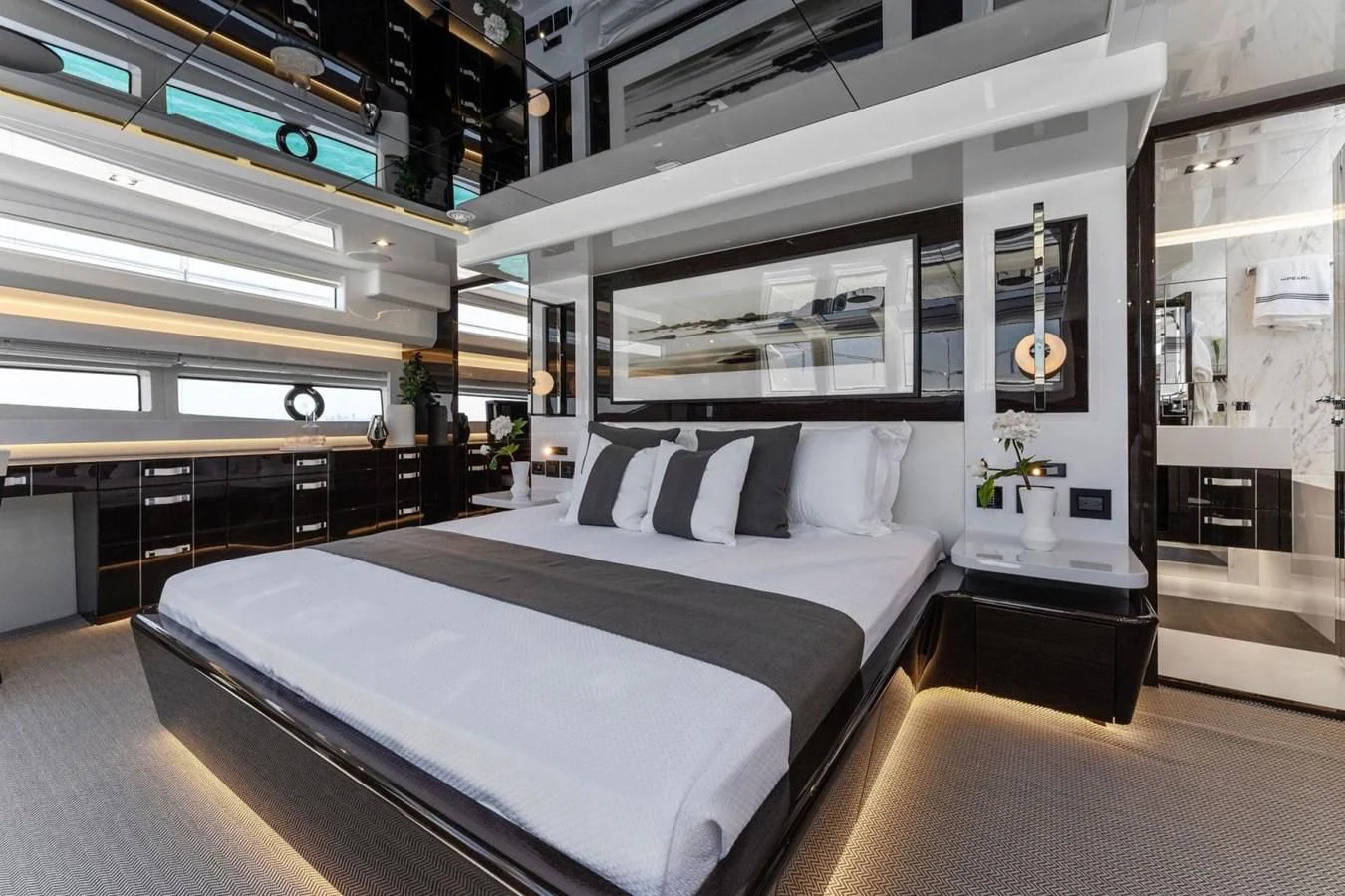a room with a bed and a desk aboard KNEAD IT Yacht for Sale