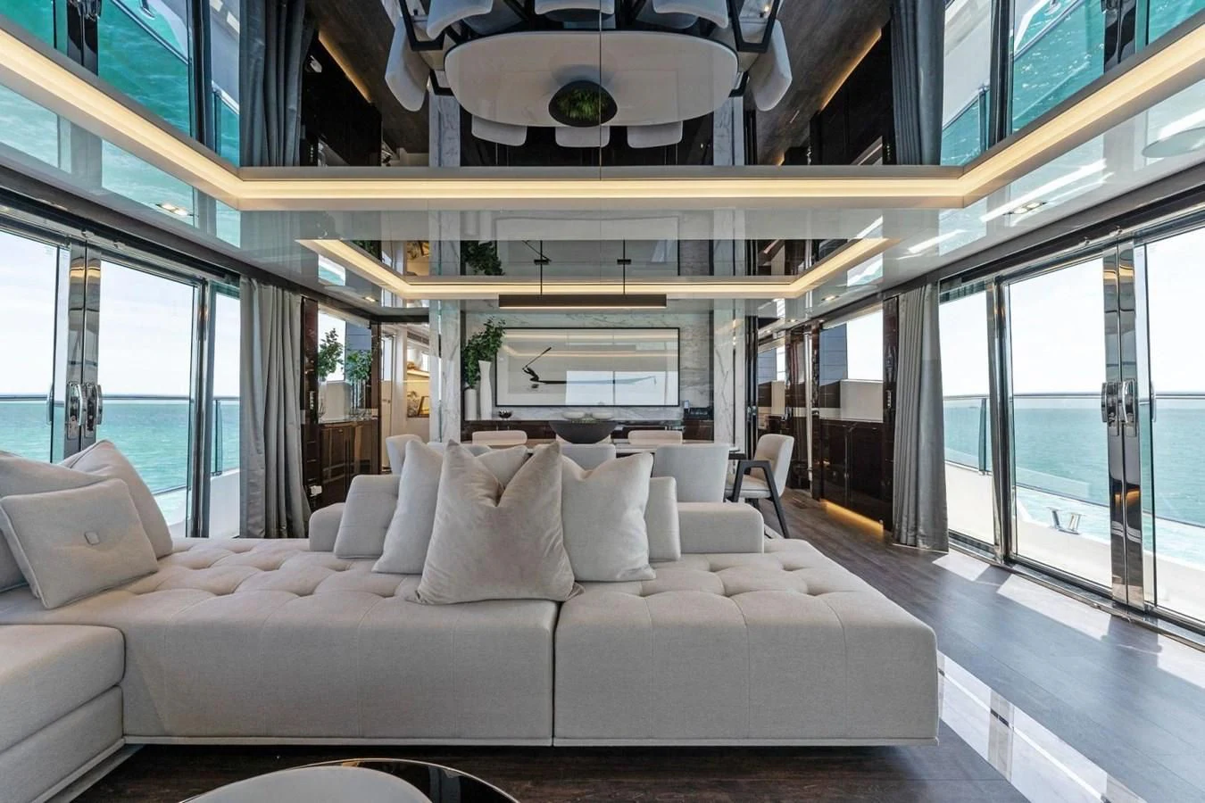 a white couch in a room aboard KNEAD IT Yacht for Sale