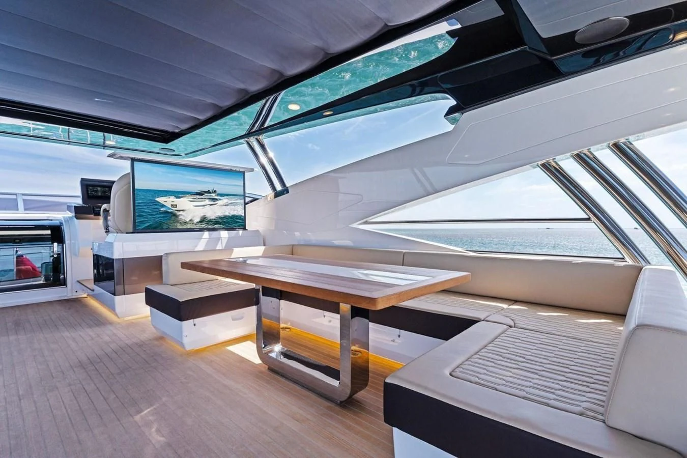 a room with a table and a couch aboard KNEAD IT Yacht for Sale