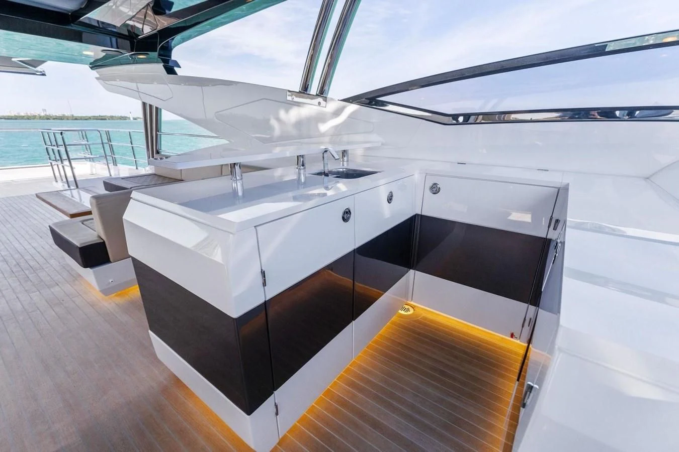 a large white kitchen with a black and white counter top aboard KNEAD IT Yacht for Sale