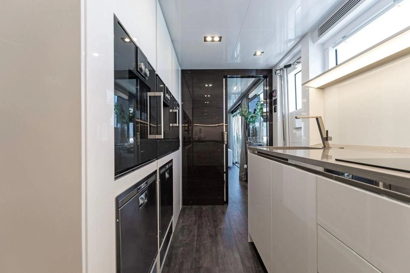 a kitchen with a large mirror aboard KNEAD IT Yacht for Sale