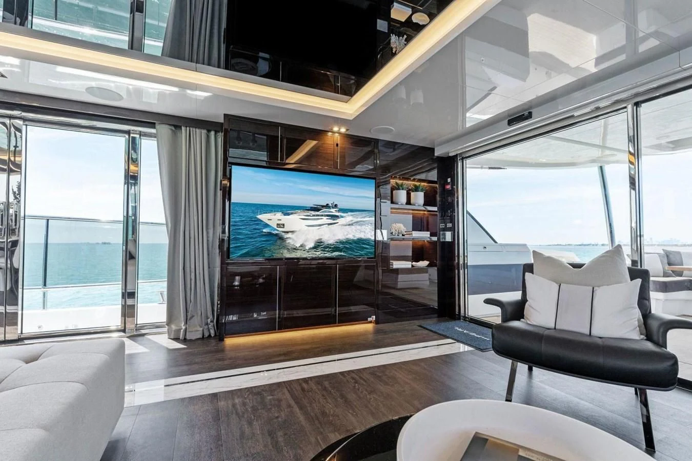a room with a large screen aboard KNEAD IT Yacht for Sale