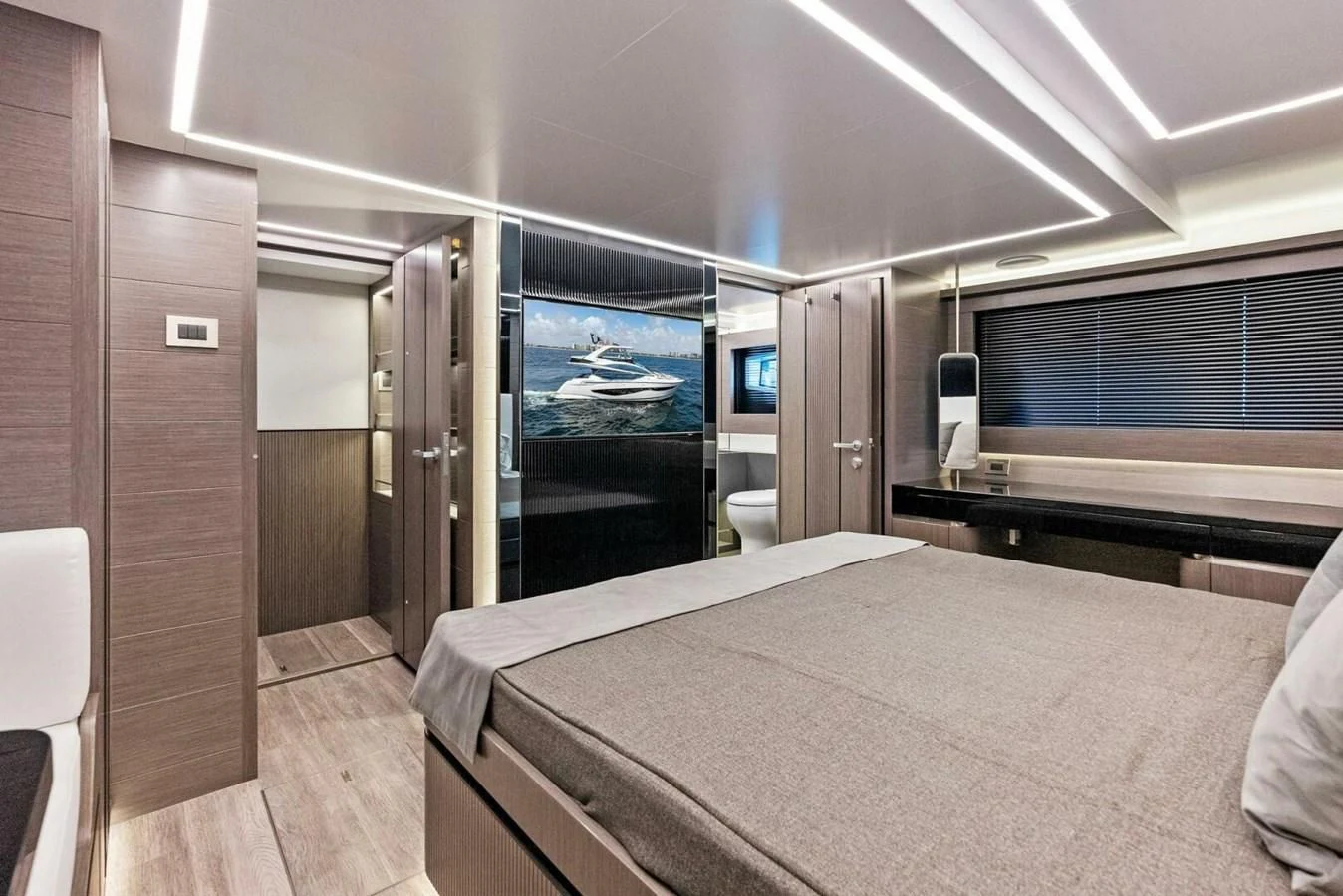 a room with a bed and a large screen aboard KNEAD IT Yacht for Sale