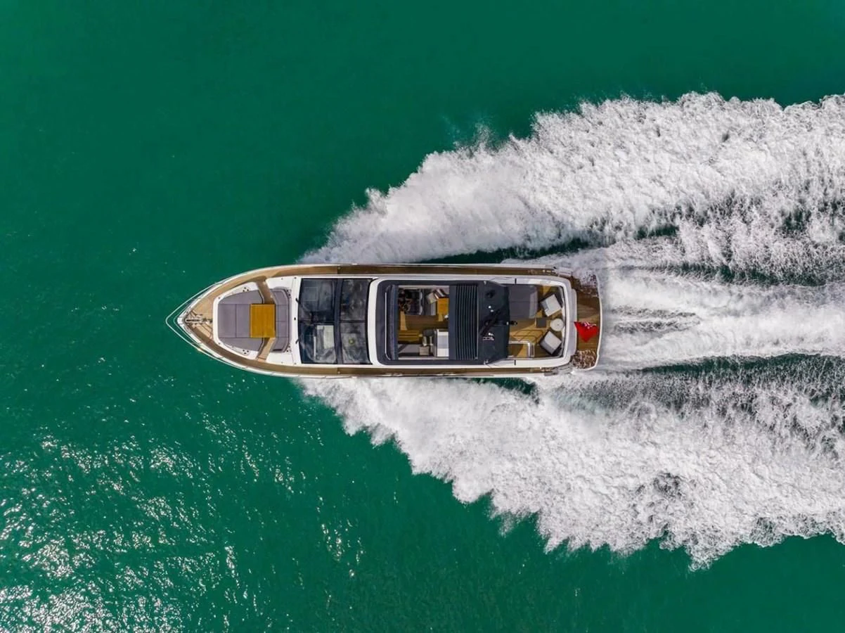 a helicopter flying over a sea aboard KNEAD IT Yacht for Sale