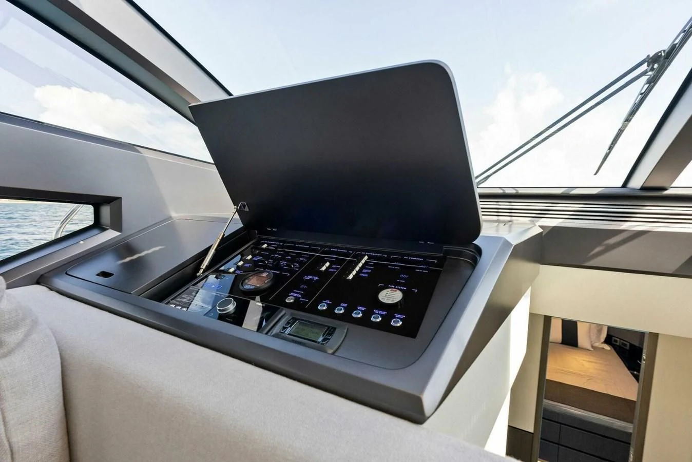 a black laptop on a car dashboard aboard KNEAD IT Yacht for Sale