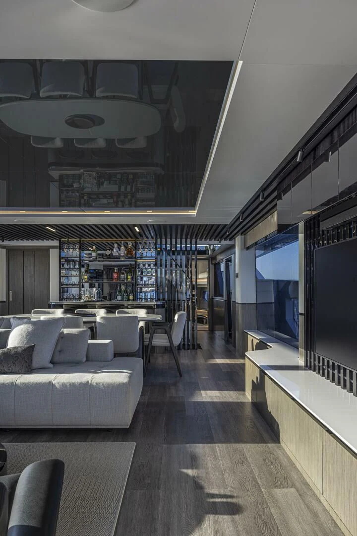 a room with a couch and a tv aboard KNEAD IT Yacht for Sale