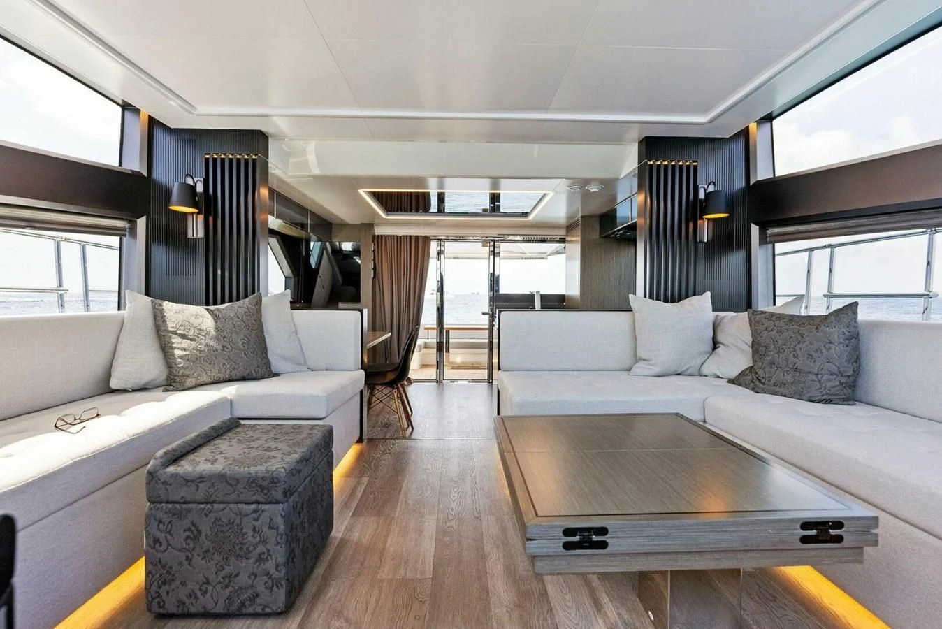 a living room with a couch and a coffee table aboard KNEAD IT Yacht for Sale