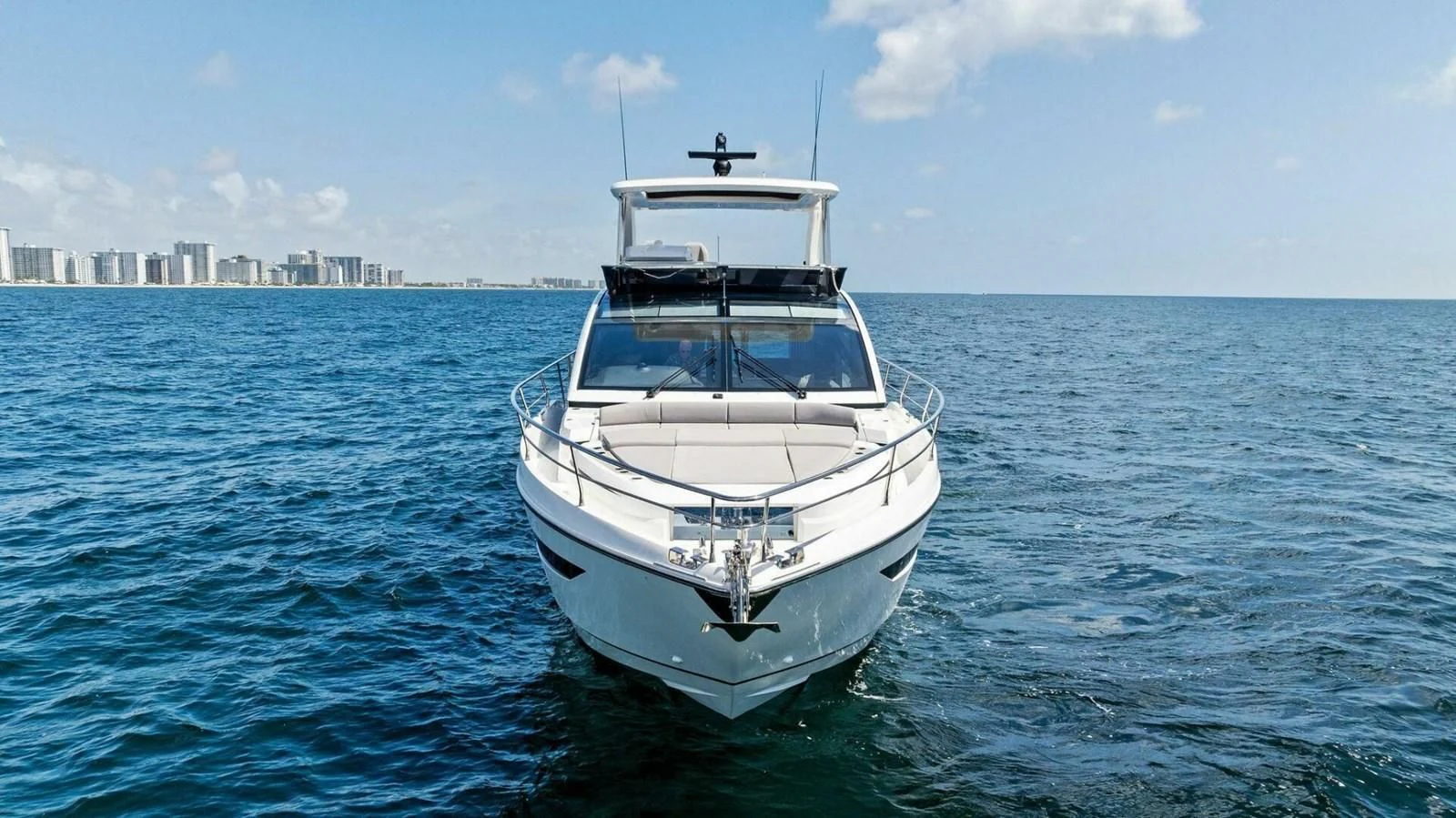 a white boat in the water aboard KNEAD IT Yacht for Sale