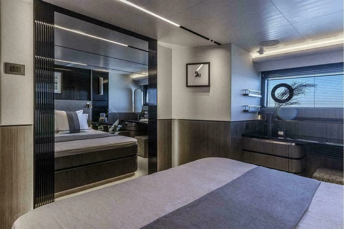 a room with a bed and a large mirror aboard KNEAD IT Yacht for Sale