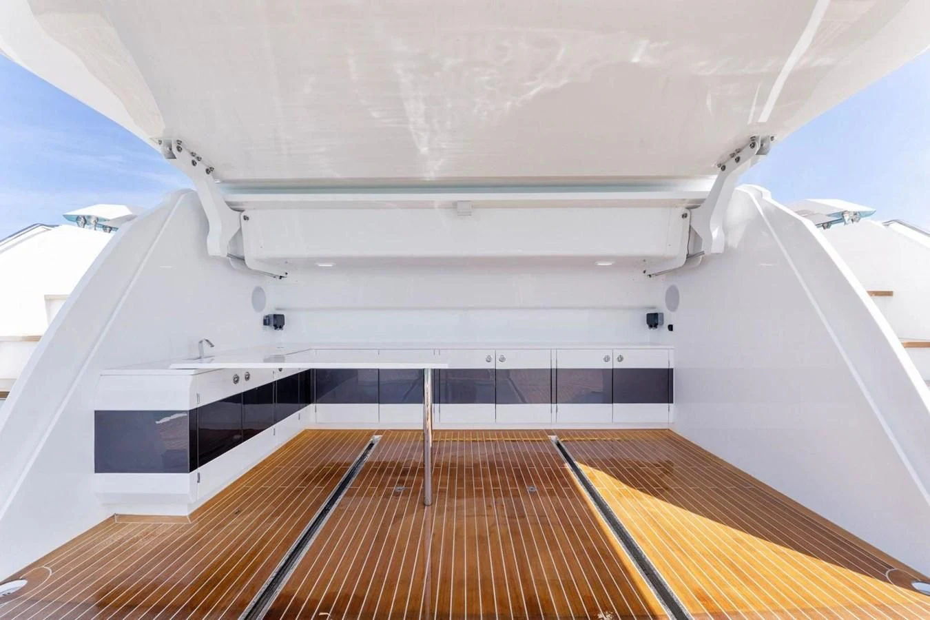 a white building with a wood floor aboard KNEAD IT Yacht for Sale