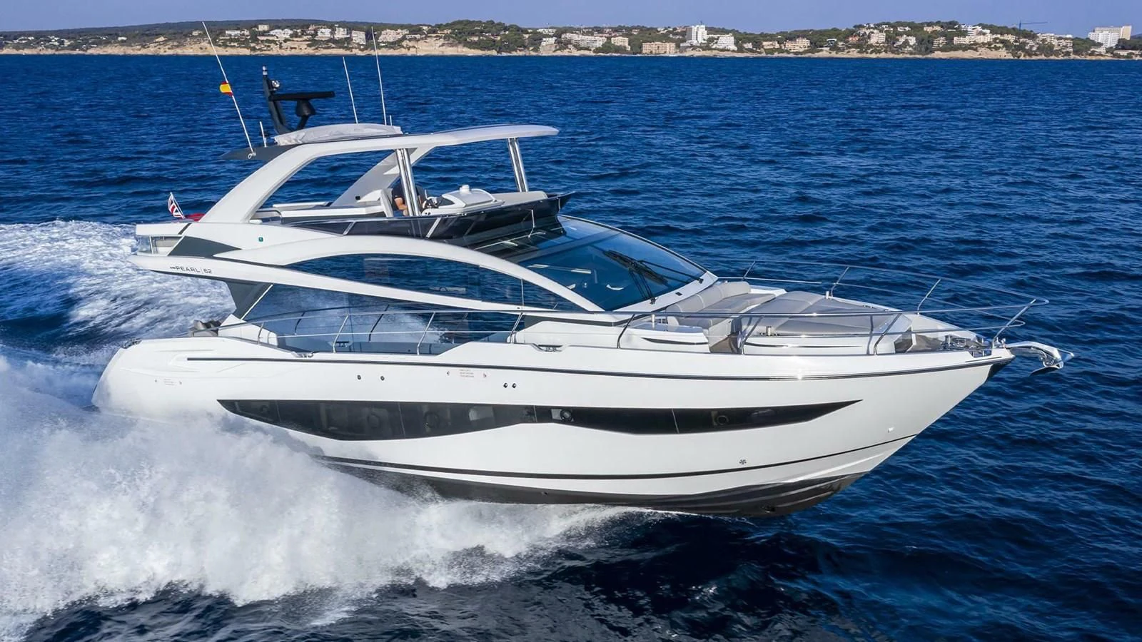 a white yacht on the water aboard KNEAD IT Yacht for Sale