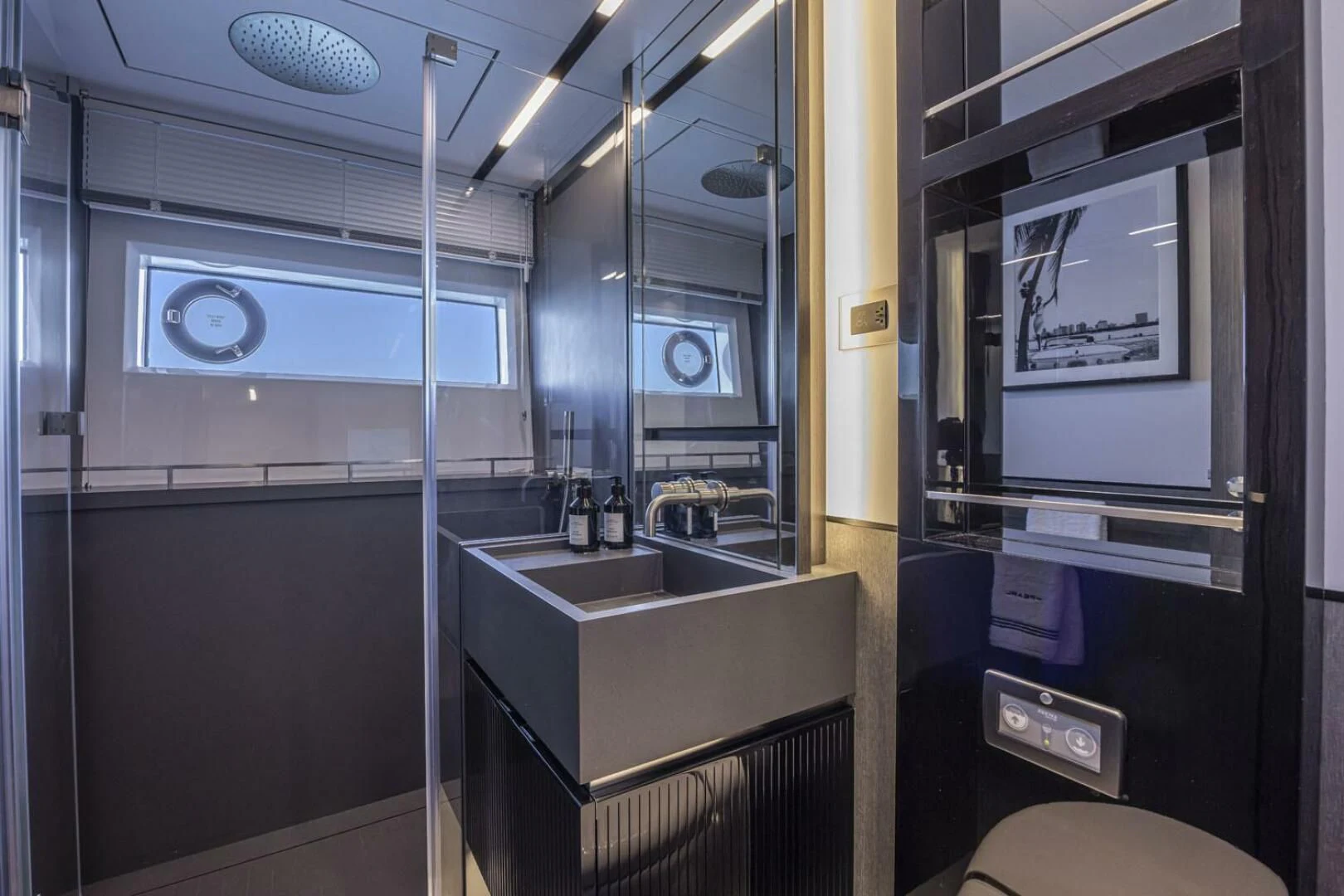 a bathroom with a sink and a mirror aboard KNEAD IT Yacht for Sale