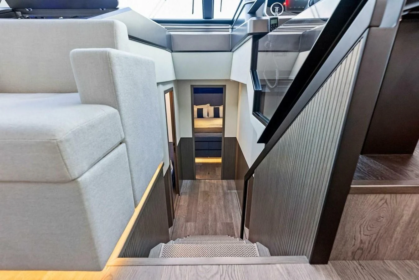 a couch and a chair in a room aboard KNEAD IT Yacht for Sale