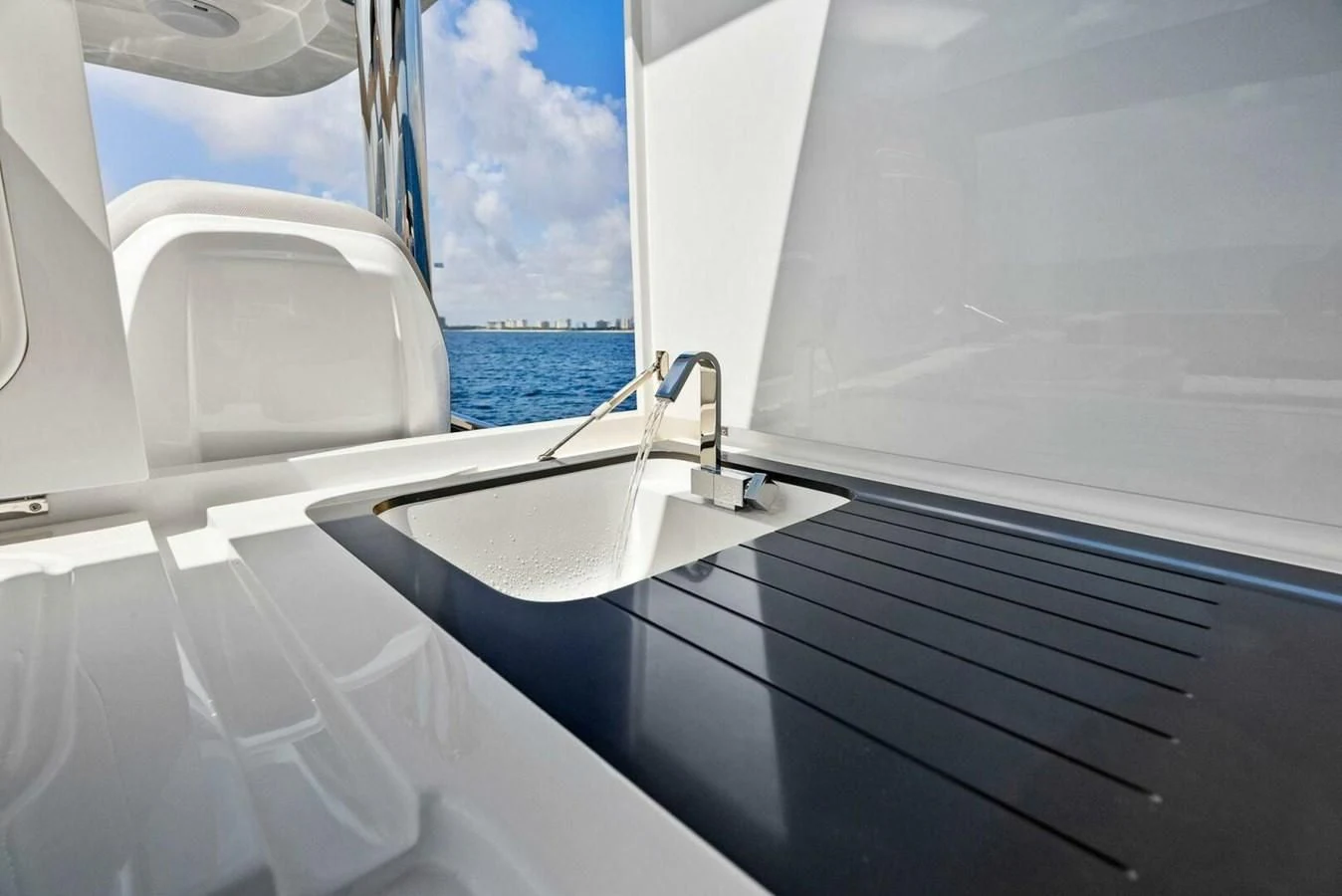 a white boat with a sink aboard KNEAD IT Yacht for Sale