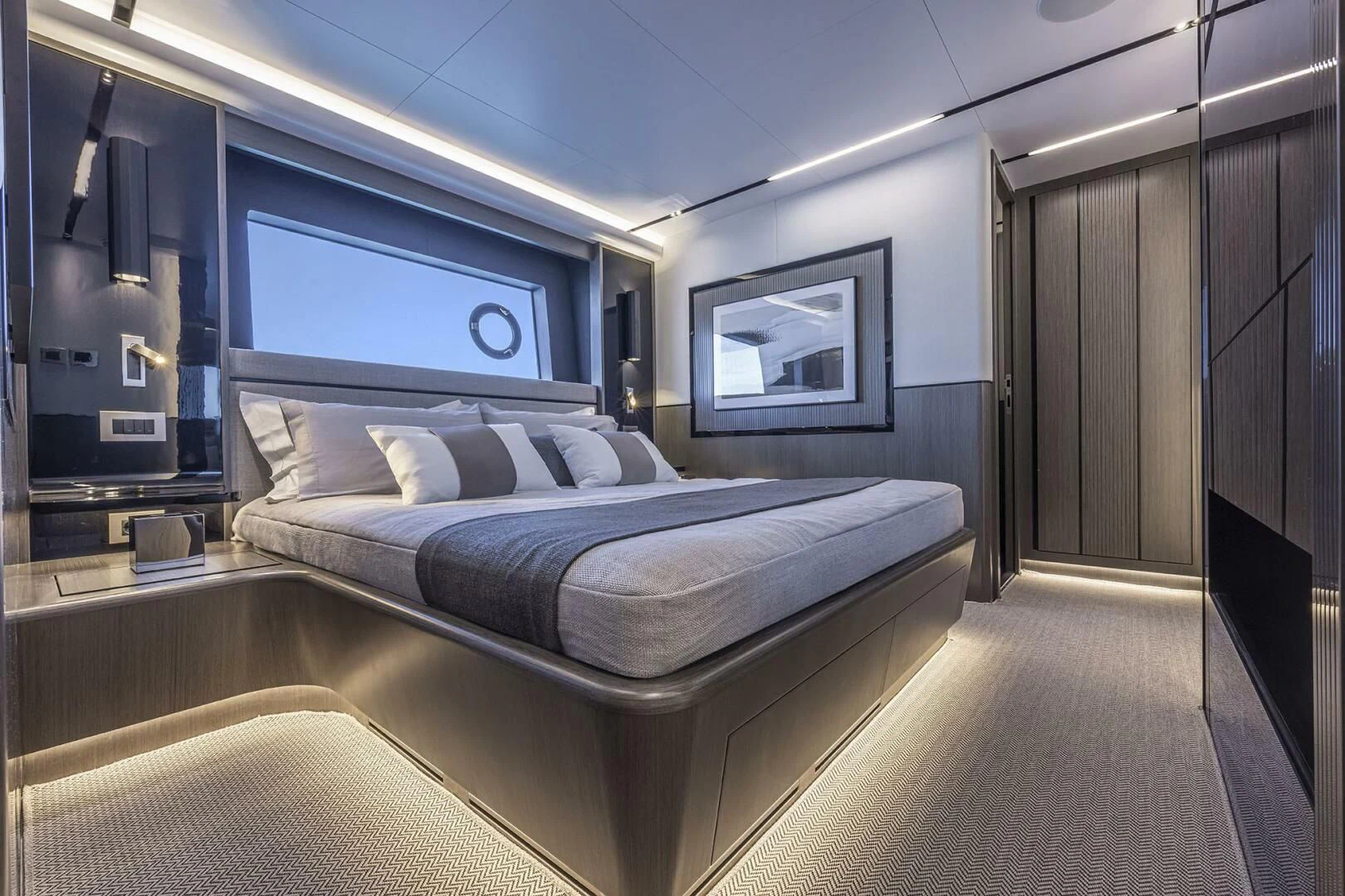 a room with a bed and a mirror aboard KNEAD IT Yacht for Sale