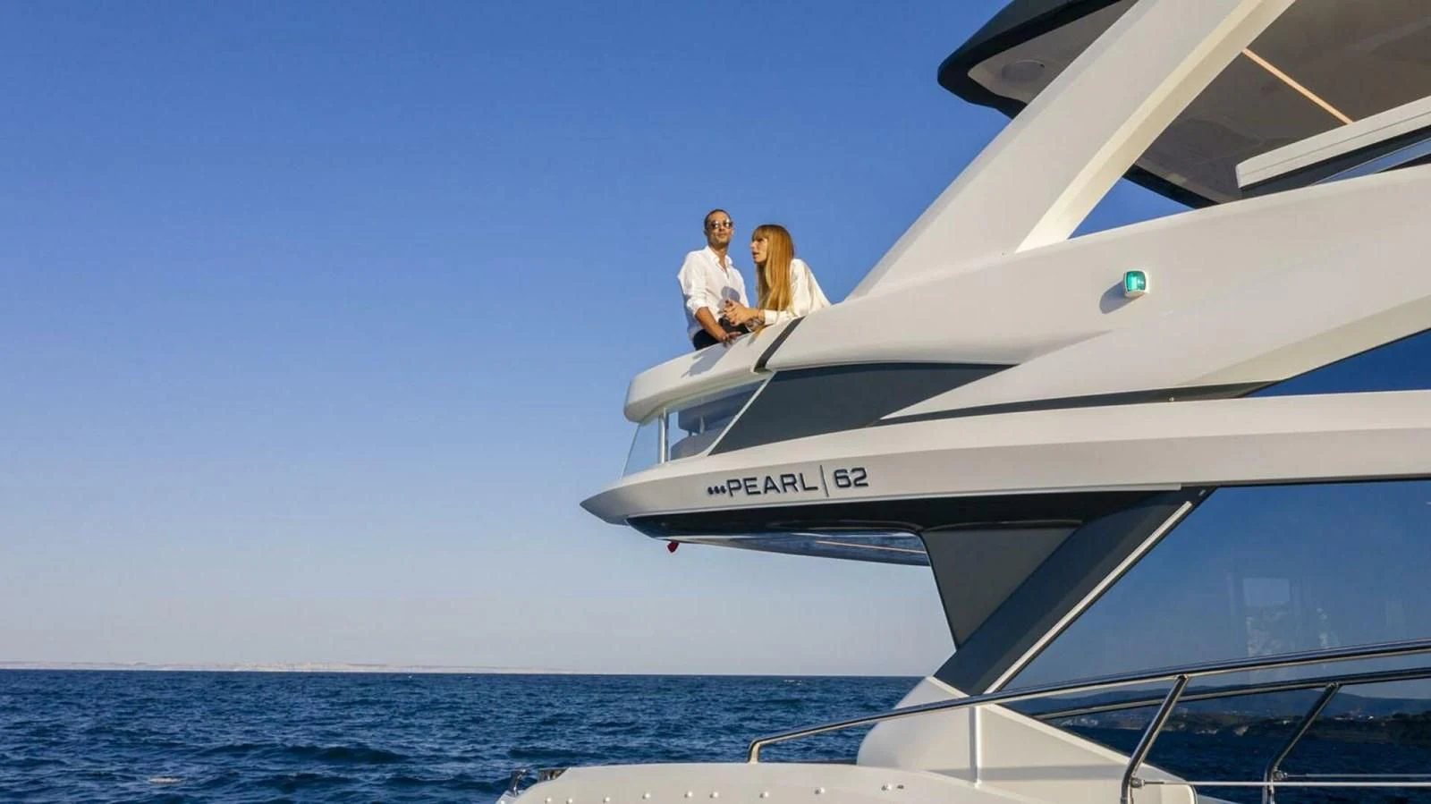 a couple of people sitting on a boat in the water aboard KNEAD IT Yacht for Sale