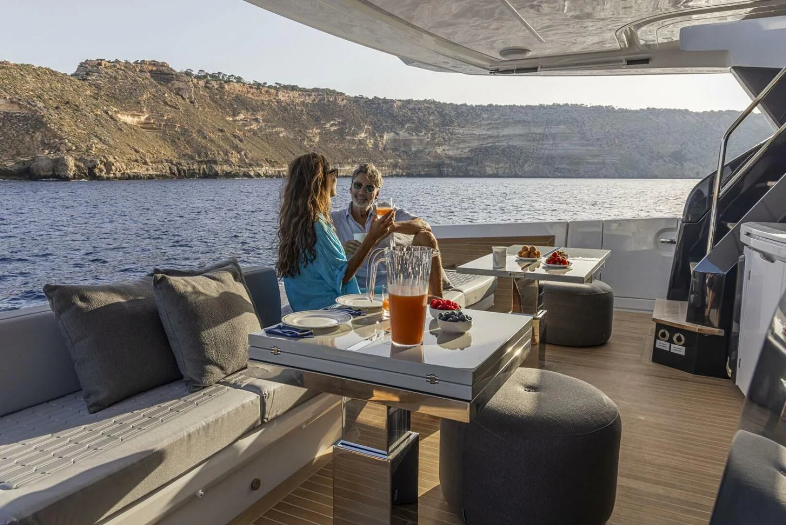 a couple sitting on a boat aboard KNEAD IT Yacht for Sale