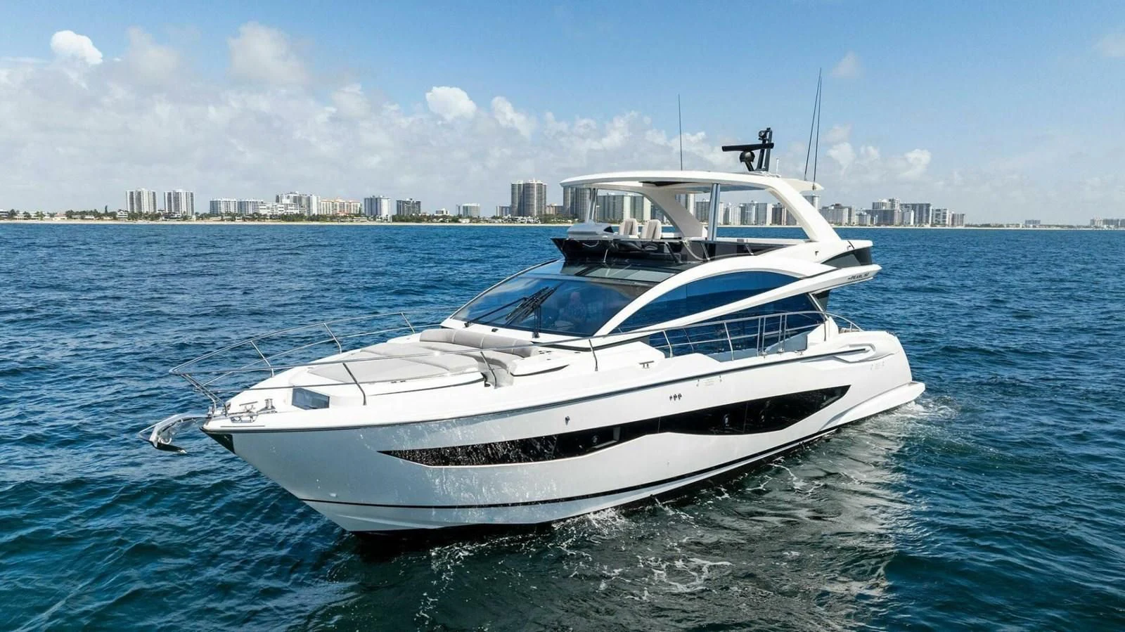 a white yacht in the water aboard KNEAD IT Yacht for Sale