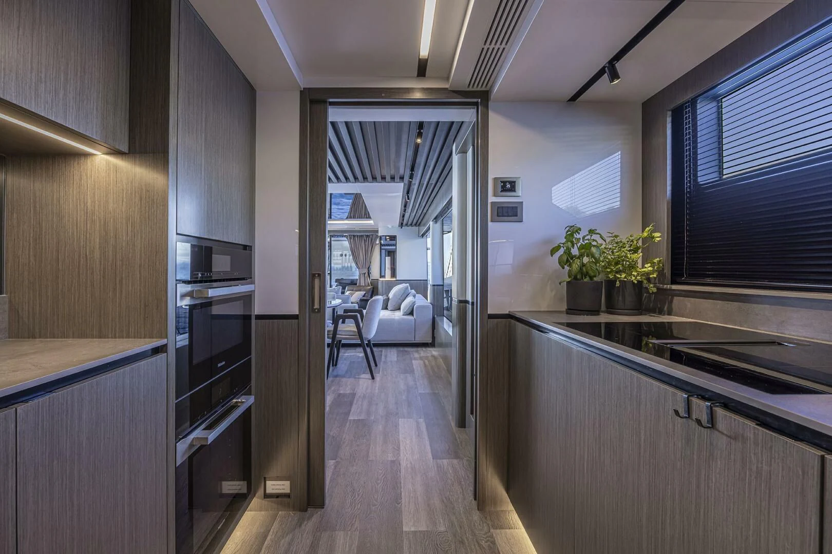 a kitchen with a wood floor aboard KNEAD IT Yacht for Sale